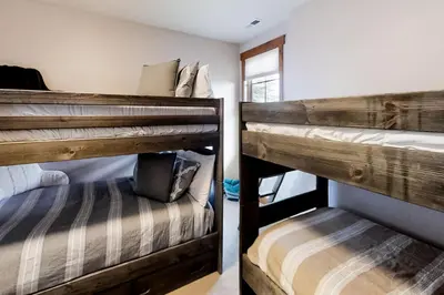 a couple of bunk beds in a room at Mountain Sky in Granby