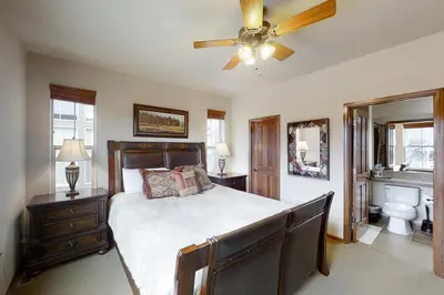 a bedroom with a bed and a ceiling fan at Deer Track Retreat in Granby