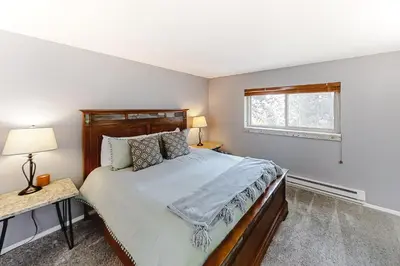 a bedroom with a large bed and a window at Beaver Village 15-11 in Winter Park