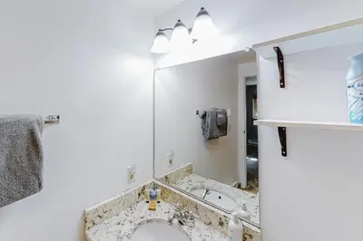 a bathroom with a sink and a mirror at Beaver Village 15-11 in Winter Park