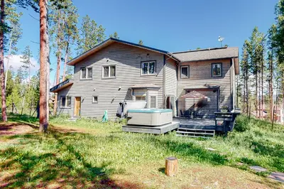 a large house with a tub in the yard at Big Bear Palace in Fraser