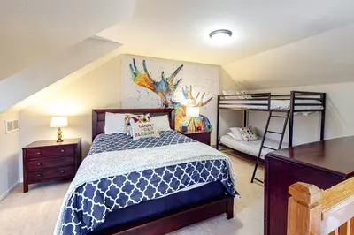 a bedroom with a bed and a bunk bed at Summit Point Place in Granby