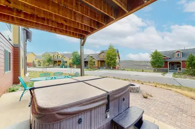 a suitcase sitting on the patio of a house at Summit Point Place in Granby