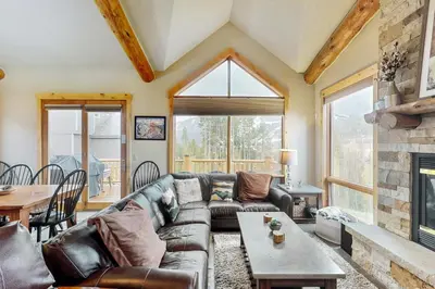 a living room with a couch and a fireplace at The Antlers 401 in Winter Park