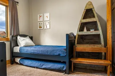 a childs bedroom with a bed and a pirate tent at Infinity View in Grand Lake