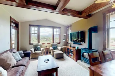 a living room with a couch and a tv at Cozens Pointe D201 in Fraser