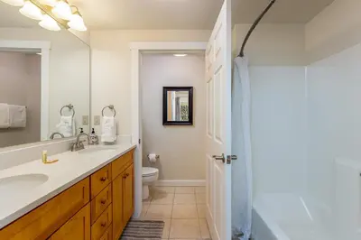 a bathroom with a sink and a toilet and a shower at The Seasons 1834 condo in Keystone