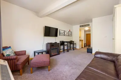 a living room with a couch and a table at 5087 Gateway home in Keystone