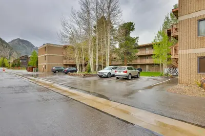 a parking lot with several cars parked in it at Walk to Main St! Condo with Hot Tub and Pool in Frisco in Frisco