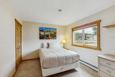 a bedroom with a bed and a window at The Cove Retreat in Dillon