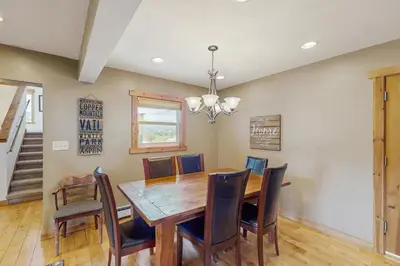a dining room with a wooden table and chairs at The Cove Retreat in Dillon