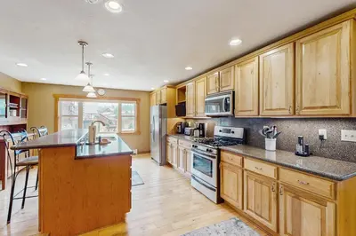 a kitchen with wooden cabinets and a counter top at The Cove Retreat in Dillon