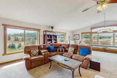 a living room with a couch and a table at The Cove Retreat in Dillon