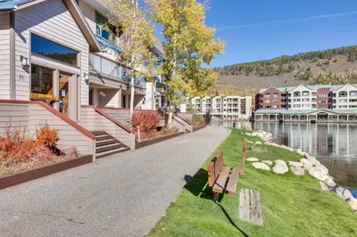 a walkway in front of a building next to a lake at 1 Mi to Keystone Ski Lift Lakefront 4-Season Gem in Dillon