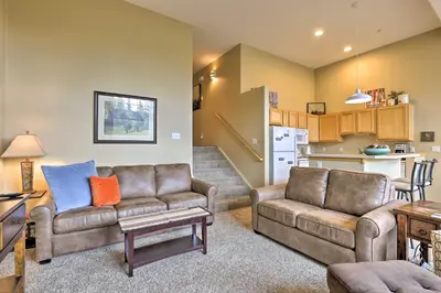 a living room with two couches and a kitchen at Silverthorne Gem with Community Perks 11 Mi to Ski! in Silverthorne