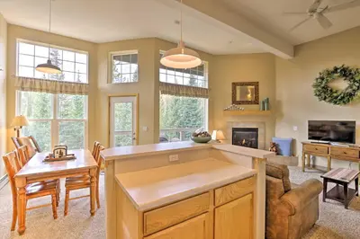 a kitchen and living room with a table and chairs at Silverthorne Gem with Community Perks 11 Mi to Ski! in Silverthorne