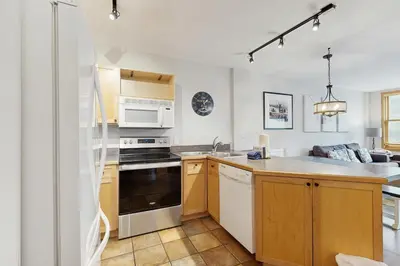 a kitchen with a sink and a stove top oven at Silvermill Lodge 8250 in Keystone