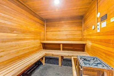a wooden sauna with a bench in it at Silvermill Lodge 8250 in Keystone