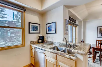 a kitchen with a sink and a window at Premiere 2Br Townhome - Shuttle to Slopes, Kids Ski Free! condo in Keystone