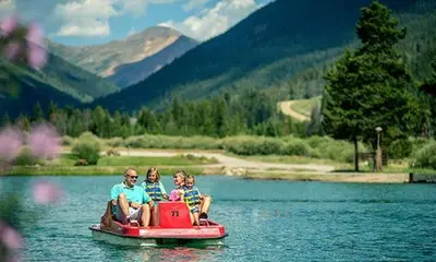 a group of people sitting on a boat in the water at Premiere 2Br Townhome - Shuttle to Slopes, Kids Ski Free! condo in Keystone
