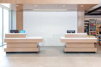 a lobby of a store with two checkout counters at Hilton Garden Inn Broomfield Boulder in Broomfield