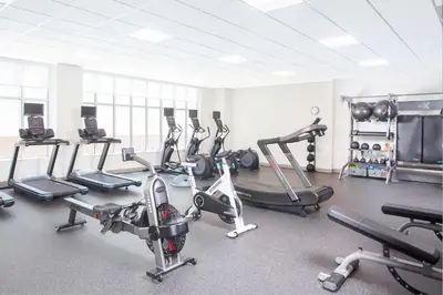 a gym with several treadmills and exercise bikes at Homewood Suites By Hilton Broomfield Boulder in Broomfield
