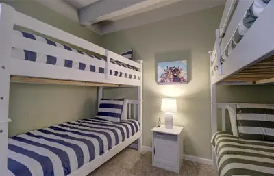 a bedroom with two bunk beds and a desk at B207 Ten Mile Island 2Br 2Ba condo in Frisco