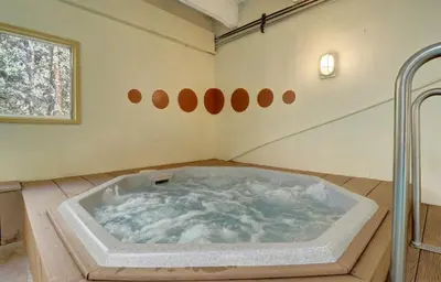 a jacuzzi tub in the middle of a room at B207 Ten Mile Island 2Br 2Ba condo in Frisco