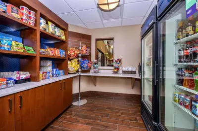 a grocery store aisle with a counter in a store at Hampton Inn & Suites Boulder North in Boulder