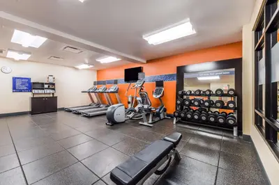 a fitness room with treadmills and weights at Hampton Inn & Suites Boulder North in Boulder