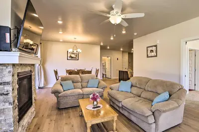 a living room with two couches and a fireplace at 1 Mi to Ski Slopes! Mtn-View Condo in Keystone in Keystone