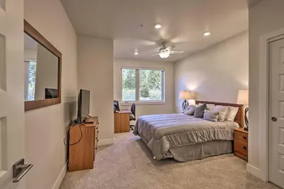 a bedroom with a bed and a tv and a window at 1 Mi to Ski Slopes! Mtn-View Condo in Keystone in Keystone