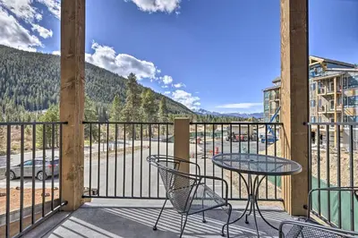 a patio with a table and chairs on a balcony at 1 Mi to Ski Slopes! Mtn-View Condo in Keystone in Keystone
