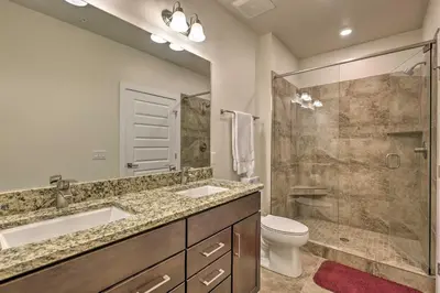 a bathroom with two sinks and a shower and a toilet at 1 Mi to Ski Slopes! Mtn-View Condo in Keystone in Keystone