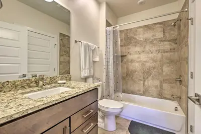 a bathroom with a sink and a toilet and a tub at 1 Mi to Ski Slopes! Mtn-View Condo in Keystone in Keystone