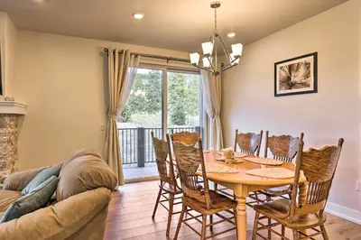 a dining room with a table and chairs and a couch at 1 Mi to Ski Slopes! Mtn-View Condo in Keystone in Keystone
