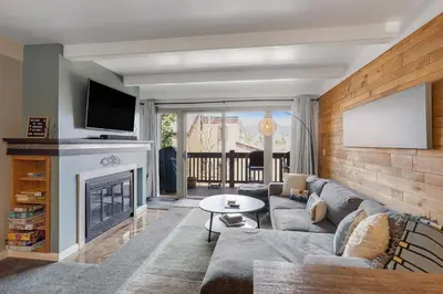 a living room with a couch and a fireplace at Mountain Views & Meadows in Silverthorne