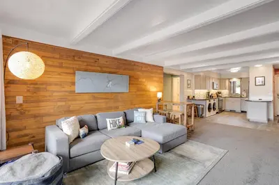 a living room with a couch and a table at Mountain Views & Meadows in Silverthorne