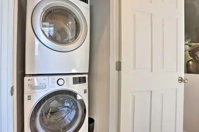 a washing machine and a washer and dryer in a room at Near Hiking and Biking Trails Townhome with Patio in Aurora