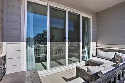 a screened in porch with a couch on a balcony at Near Hiking and Biking Trails Townhome with Patio in Aurora