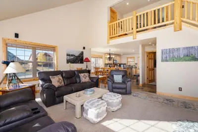 a living room with a couch and a table at 67 Fireweed 27A by Stay Winter Park in Tabernash