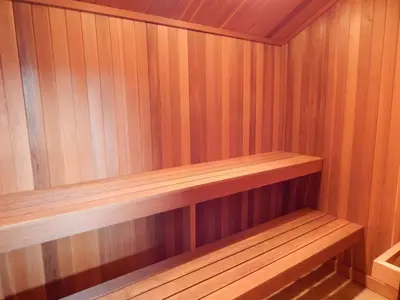 a small sauna with a wooden shelf in it at Snowblaze Condos Building E unit 310 by Stay Winter Park in Winter Park