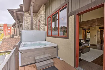 a hot tub on the balcony of a house at Luxurious Fraser Townhome with Private Hot Tub! in Fraser