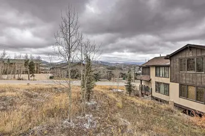 an old house in the middle of a field at Luxurious Fraser Townhome with Private Hot Tub! in Fraser