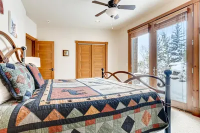 a bedroom with a bed and a window at Gray Moose in Breckenridge