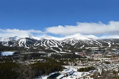 an aerial view of a town with snow covered mountains at Quaint Mountain Condo in Frisco