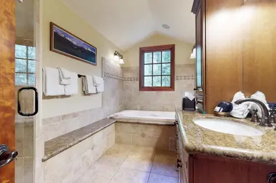 a bathroom with a sink and a bath tub at Moose Whiskers in Keystone