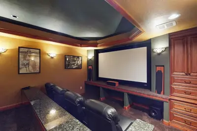 a living room with a flat screen tv and a couch at Moose Whiskers in Keystone