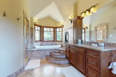 a large bathroom with a tub and a sink at Moose Whiskers in Keystone
