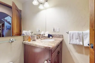 a bathroom with a sink and a mirror at Moose Whiskers in Keystone